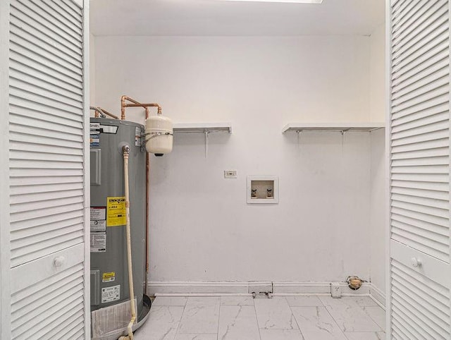 3453 Eisenhower Cir E, Atlanta, GA 30354 - laundry room featuring water heater, marble look tiles, electric dryer hookup, and hookup for a washing machine