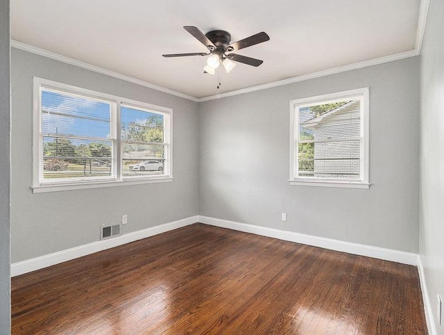 3453 Eisenhower Cir E, Atlanta, GA 30354 - unfurnished room featuring plenty of natural light, dark wood finished floors, baseboards, and crown molding