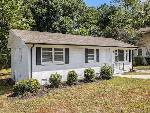 3453 Eisenhower Cir E, Atlanta, GA 30354 - view of front facade with brick siding, a front yard, crawl space, and roof with shingles