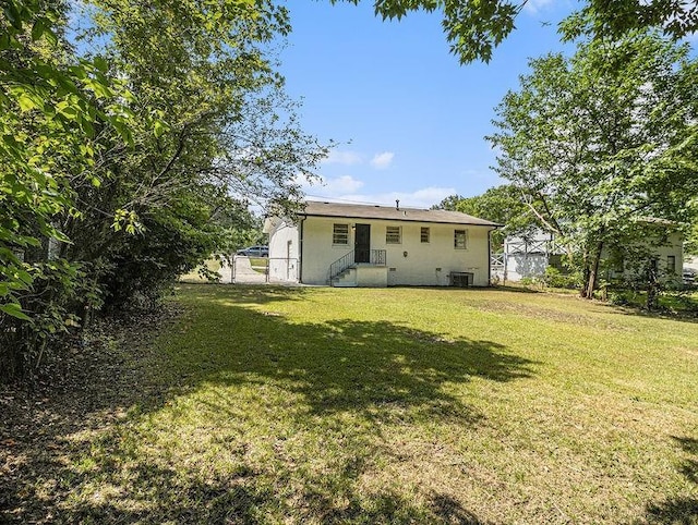 3453 Eisenhower Cir E, Atlanta, GA 30354 - rear view of house with a lawn