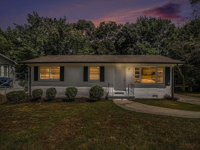 3453 Eisenhower Cir E, Atlanta, GA 30354 - view of front of home with brick siding, a front yard, and crawl space