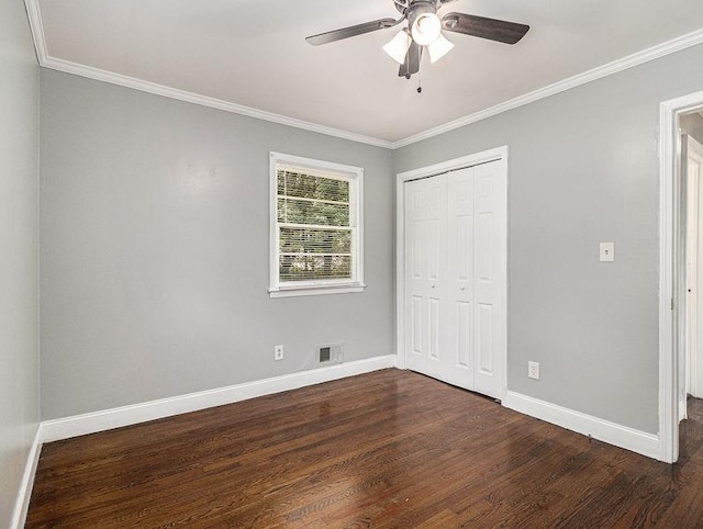 3453 Eisenhower Cir E, Atlanta, GA 30354 - unfurnished bedroom with dark wood-type flooring, ornamental molding, baseboards, a closet, and ceiling fan