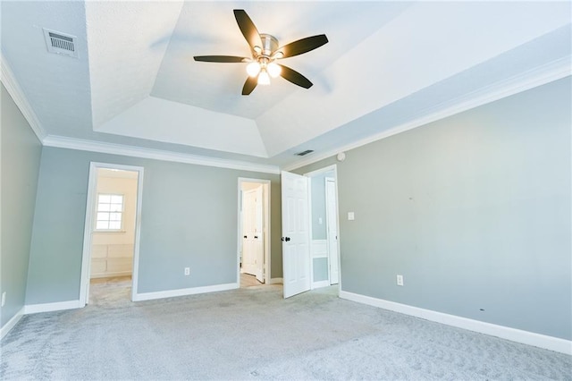 unfurnished bedroom featuring ornamental molding, light carpet, baseboards, and visible vents