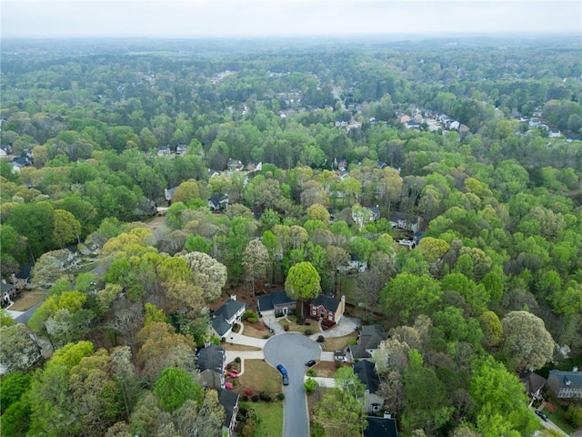 drone / aerial view featuring a view of trees