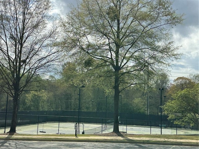 view of sport court with fence