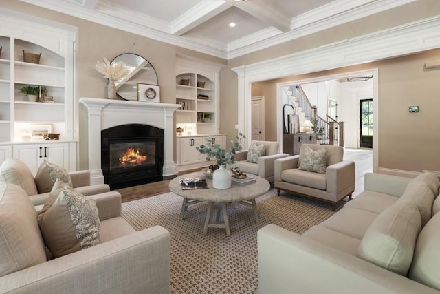 living room with light hardwood / wood-style floors, coffered ceiling, built in features, ornamental molding, and beam ceiling