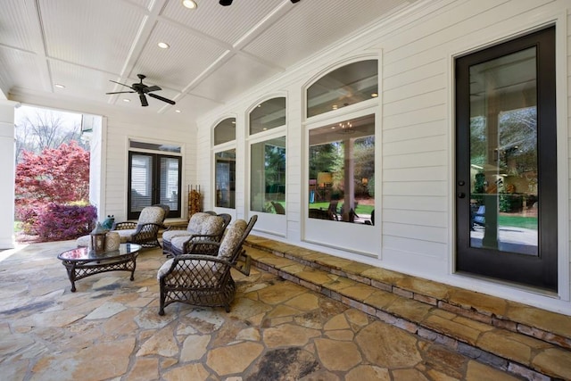 view of patio featuring ceiling fan and an outdoor living space