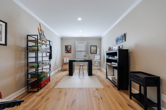 home office featuring ornamental molding and light hardwood / wood-style floors