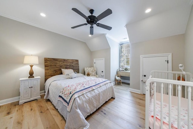 bedroom featuring ceiling fan, lofted ceiling, crown molding, and light hardwood / wood-style floors