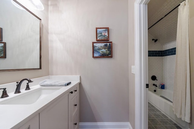 bathroom with tile patterned flooring, shower / bath combo, and vanity