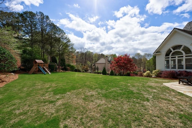 view of yard with a playground