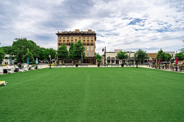 surrounding community featuring a lawn