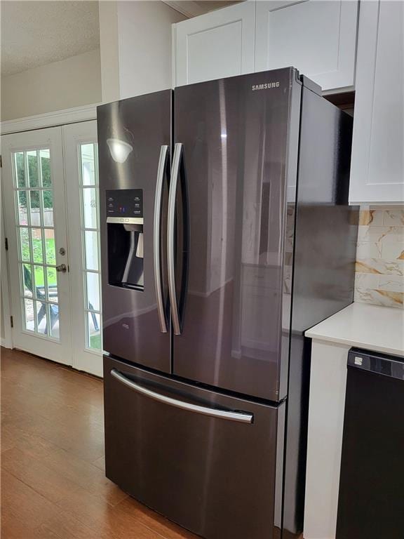 2913 Jordan Forest Trl, Lawrenceville, GA 30044 - kitchen featuring stainless steel fridge with ice dispenser, dishwasher, backsplash, white cabinets, and light countertops