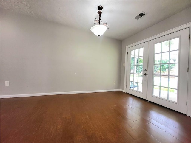 2913 Jordan Forest Trl, Lawrenceville, GA 30044 - empty room with french doors and dark wood-type flooring