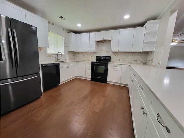 2913 Jordan Forest Trl, Lawrenceville, GA 30044 - kitchen with black appliances, open shelves, light countertops, white cabinets, and backsplash