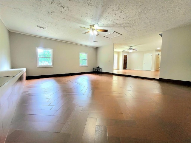 2913 Jordan Forest Trl, Lawrenceville, GA 30044 - spare room with ceiling fan and a textured ceiling