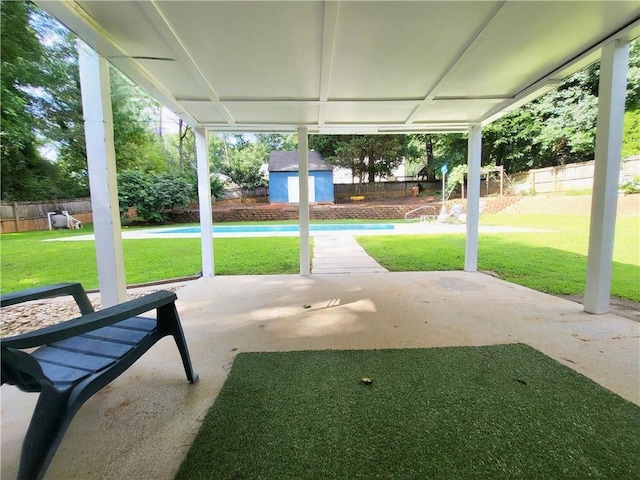 2913 Jordan Forest Trl, Lawrenceville, GA 30044 - fenced backyard featuring a patio and a shed