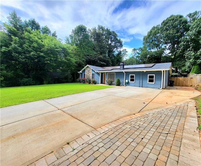 2913 Jordan Forest Trl, Lawrenceville, GA 30044 - single story home featuring roof mounted solar panels and concrete driveway