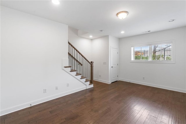 empty room with dark hardwood / wood-style floors