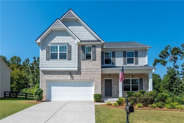 view of front of home featuring a front yard and a garage