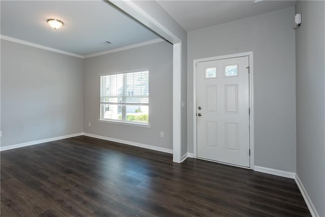 entrance foyer featuring dark hardwood / wood-style flooring and ornamental molding