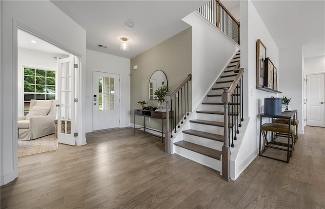 317 Foxglove Way, Mcdonough, GA 30253 - foyer with wood finished floors, stairs, and baseboards