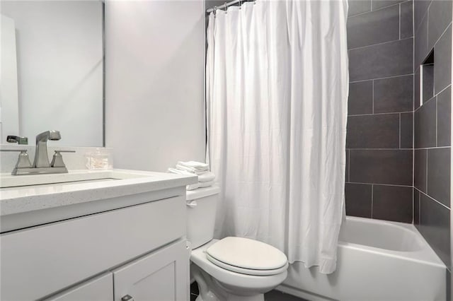 full bathroom featuring vanity, toilet, and shower / bath combo with shower curtain