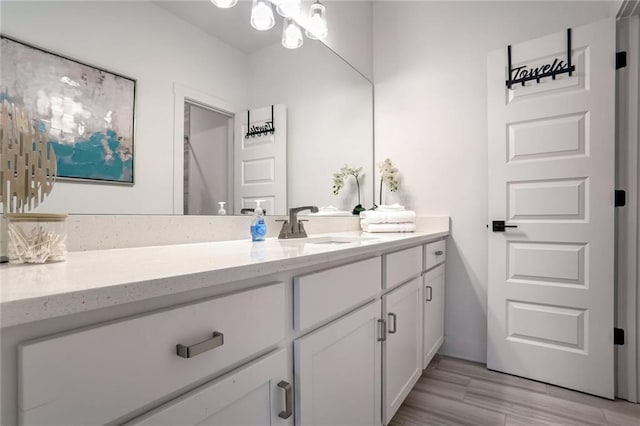 bathroom featuring wood-type flooring and vanity