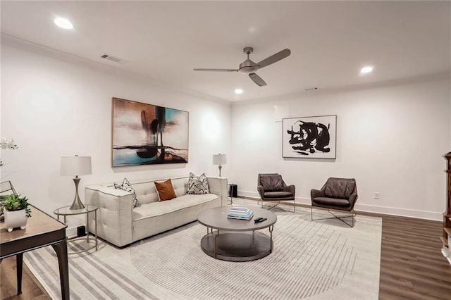 living room with hardwood / wood-style flooring and ceiling fan