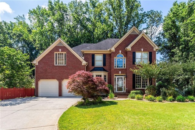 5287 Wild Indigo Way, Acworth, GA 30102 - colonial-style house with a garage, brick siding, and driveway