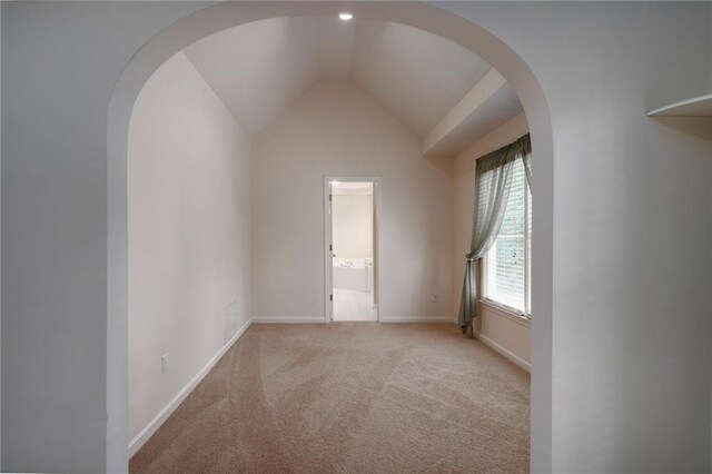 5287 Wild Indigo Way, Acworth, GA 30102 - unfurnished room with arched walkways, light carpet, and lofted ceiling