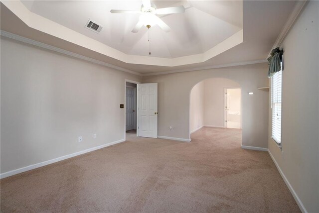 5287 Wild Indigo Way, Acworth, GA 30102 - empty room with a raised ceiling, arched walkways, ceiling fan, carpet floors, and crown molding
