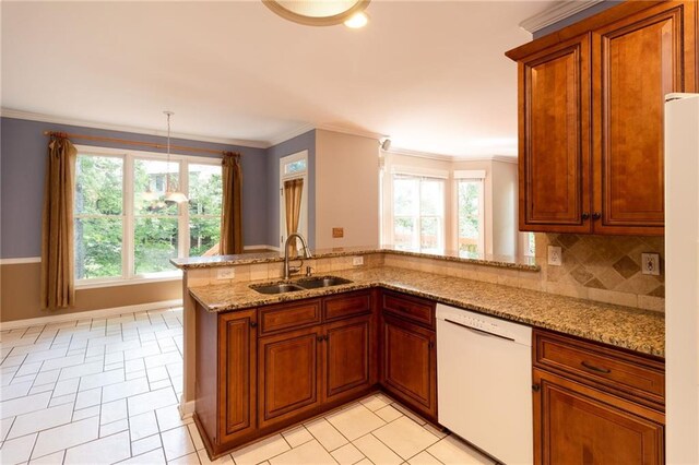 5287 Wild Indigo Way, Acworth, GA 30102 - kitchen featuring white appliances, light stone countertops, brown cabinets, a peninsula, and decorative backsplash