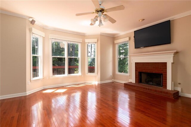 5287 Wild Indigo Way, Acworth, GA 30102 - unfurnished living room with hardwood / wood-style floors, ornamental molding, ceiling fan, and a brick fireplace
