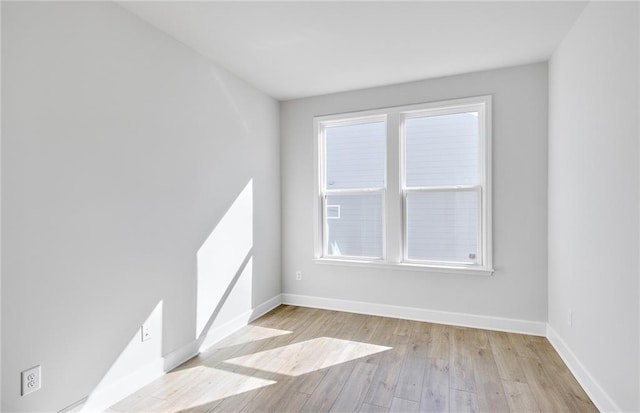 spare room featuring light hardwood / wood-style floors