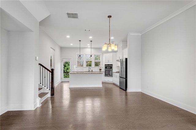 unfurnished living room with dark wood-type flooring, a sink, visible vents, baseboards, and stairs