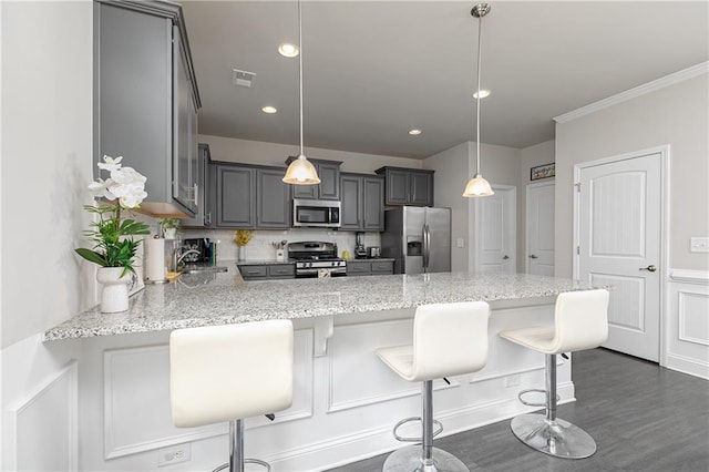 3302 Bellingham Way, Lithia Springs, GA 30122 - kitchen featuring appliances with stainless steel finishes, a peninsula, gray cabinets, decorative backsplash, and light stone countertops