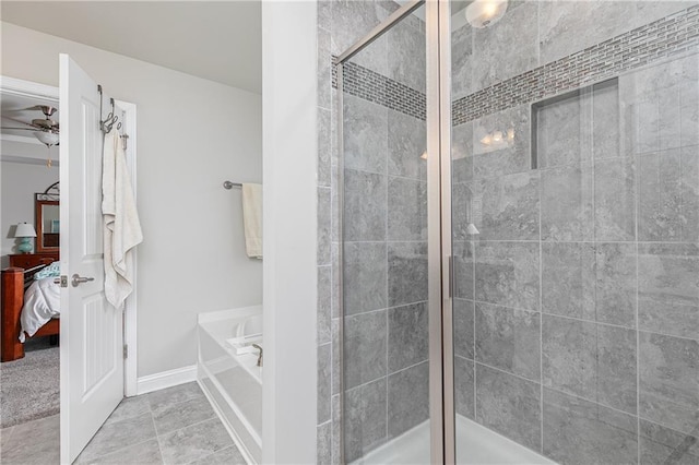 3302 Bellingham Way, Lithia Springs, GA 30122 - ensuite bathroom featuring a bath, a stall shower, and a ceiling fan
