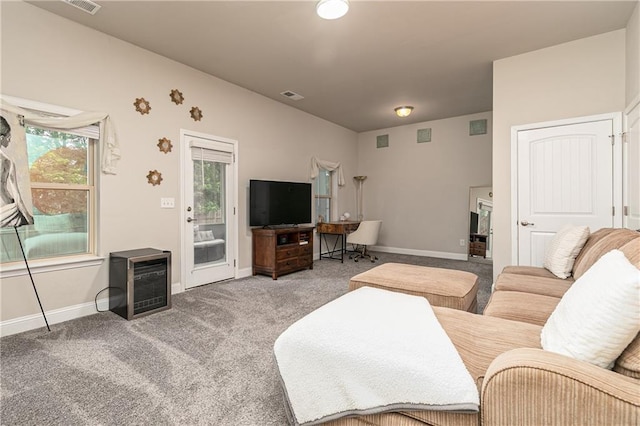 3302 Bellingham Way, Lithia Springs, GA 30122 - carpeted living room featuring baseboards and beverage cooler