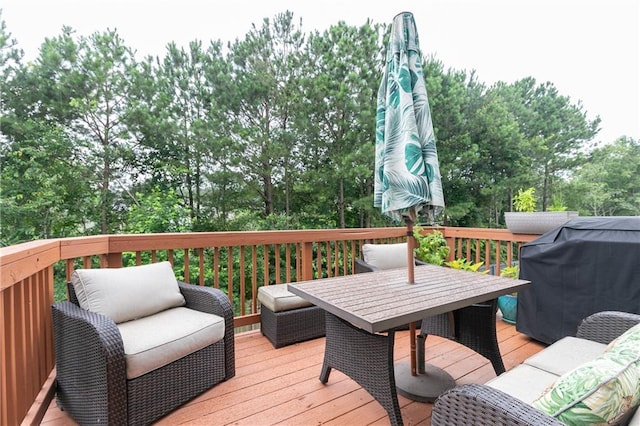 3302 Bellingham Way, Lithia Springs, GA 30122 - wooden deck with grilling area, an outdoor hangout area, outdoor dining area, and view of scattered trees
