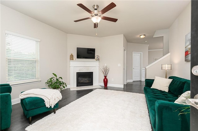 3302 Bellingham Way, Lithia Springs, GA 30122 - living room featuring dark wood-type flooring, a ceiling fan, and a fireplace