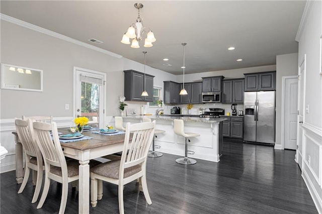 3302 Bellingham Way, Lithia Springs, GA 30122 - dining space with a chandelier, dark wood-type flooring, ornamental molding, and recessed lighting