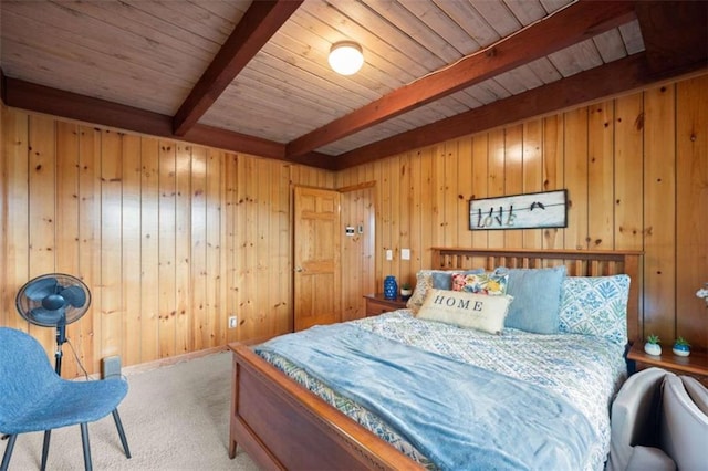 bedroom featuring wooden ceiling, wood walls, carpet, and beamed ceiling