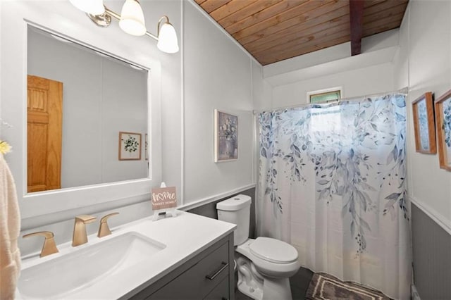 bathroom featuring toilet, vanity, wooden ceiling, and curtained shower