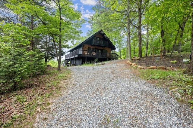 rustic home with a wooden deck