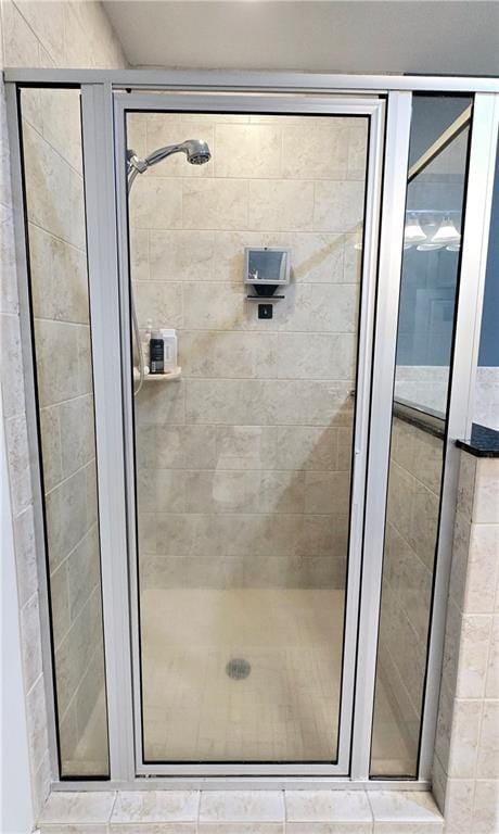 full bath featuring a shower stall