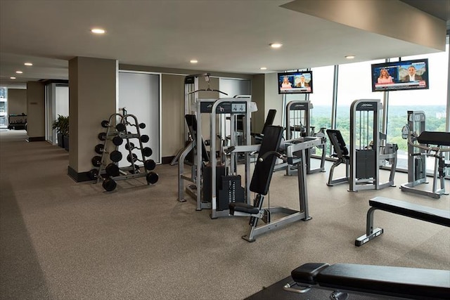 gym with recessed lighting and floor to ceiling windows