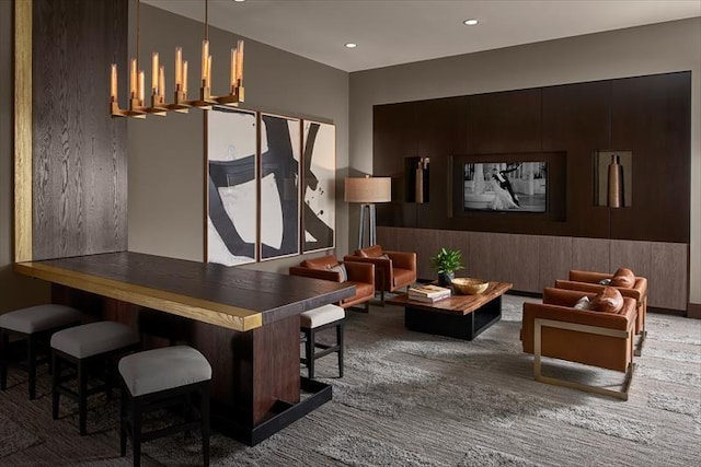 carpeted dining area with recessed lighting and a chandelier