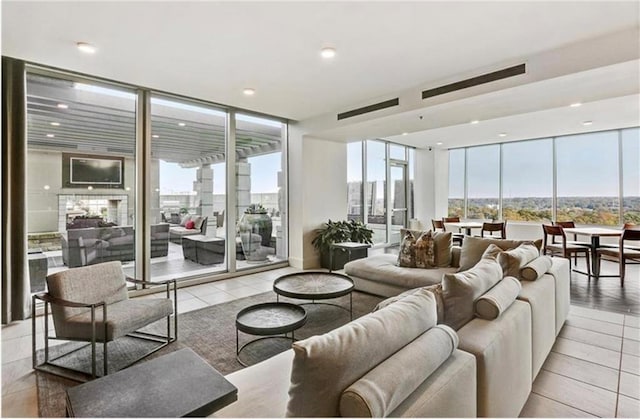 living area featuring a city view and floor to ceiling windows