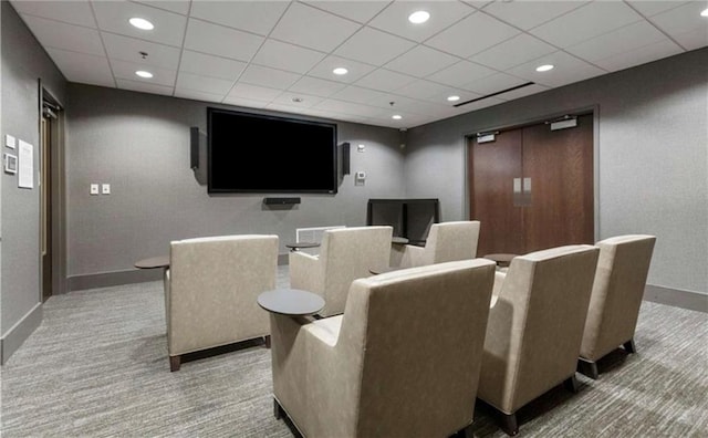 cinema room featuring recessed lighting, baseboards, carpet floors, and a drop ceiling